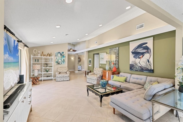 living room featuring light tile patterned floors, recessed lighting, and a barn door