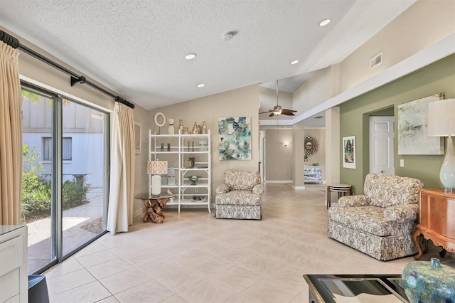 sitting room with vaulted ceiling, a textured ceiling, ceiling fan, light tile patterned floors, and recessed lighting
