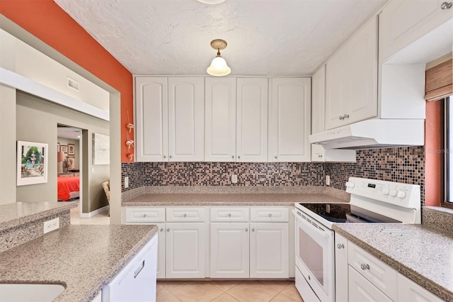 kitchen featuring white electric range, under cabinet range hood, white cabinets, and tasteful backsplash