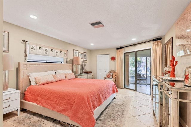 bedroom with access to exterior, recessed lighting, light tile patterned floors, and a textured ceiling