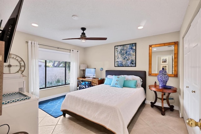 bedroom featuring light tile patterned floors, baseboards, recessed lighting, a ceiling fan, and a closet