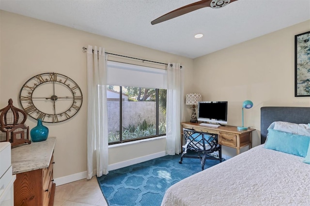 tiled bedroom with baseboards and recessed lighting