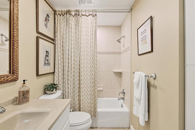 bathroom with toilet, shower / tub combo, and vanity