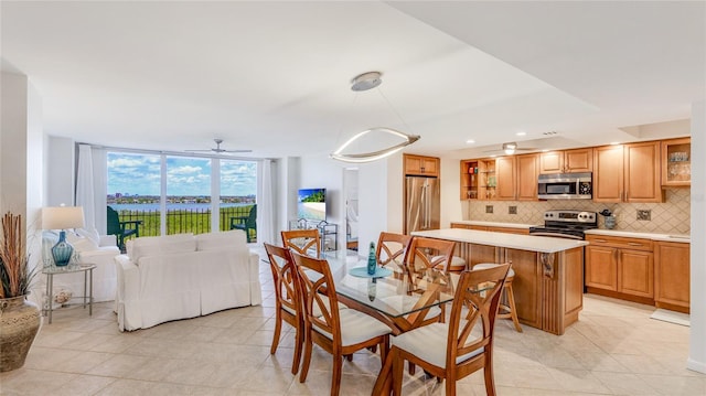 1212 Benjamin Franklin Dr Unit 909, Sarasota, FL 34236 - dining area featuring light tile patterned floors, recessed lighting, and ceiling fan
