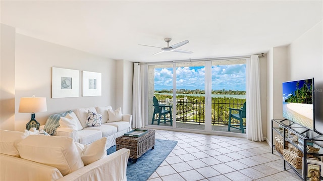 1212 Benjamin Franklin Dr Unit 909, Sarasota, FL 34236 - living room with a wall of windows, light tile patterned flooring, and a ceiling fan