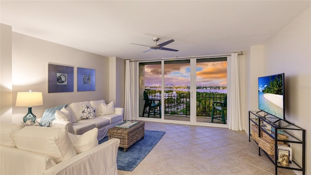 1212 Benjamin Franklin Dr Unit 909, Sarasota, FL 34236 - living room featuring expansive windows and a ceiling fan