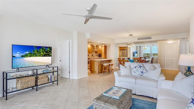 1212 Benjamin Franklin Dr Unit 909, Sarasota, FL 34236 - living area featuring a ceiling fan, light tile patterned floors, and baseboards