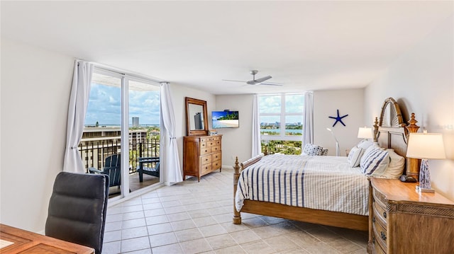 1212 Benjamin Franklin Dr Unit 909, Sarasota, FL 34236 - bedroom with access to outside, multiple windows, light tile patterned floors, and ceiling fan
