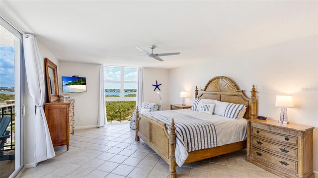 1212 Benjamin Franklin Dr Unit 909, Sarasota, FL 34236 - bedroom featuring access to outside, light tile patterned floors, ceiling fan, and baseboards
