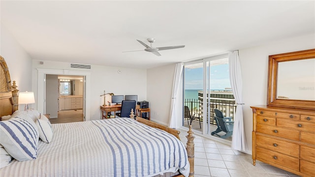 1212 Benjamin Franklin Dr Unit 909, Sarasota, FL 34236 - bedroom featuring access to outside, light tile patterned flooring, an office area, a ceiling fan, and ensuite bath