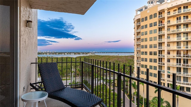 1212 Benjamin Franklin Dr Unit 909, Sarasota, FL 34236 - balcony at dusk with a water view