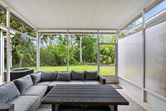 sunroom featuring an outdoor living space and plenty of natural light