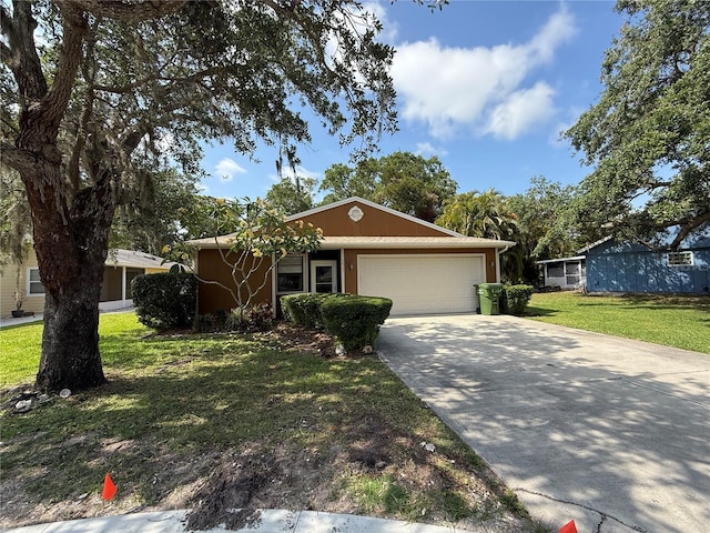 3957 Bearded Oaks Ct, Sarasota, FL 34232 - ranch-style house with a garage, driveway, and a front lawn