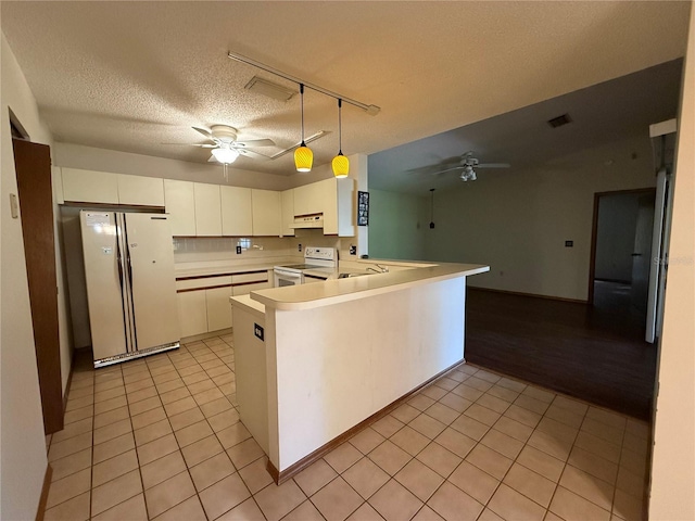 3957 Bearded Oaks Ct, Sarasota, FL 34232 - kitchen featuring white appliances, a ceiling fan, light tile patterned flooring, a peninsula, and under cabinet range hood