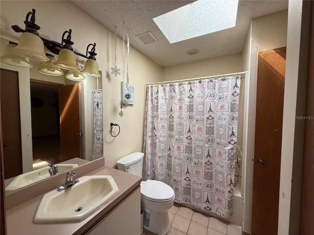 3957 Bearded Oaks Ct, Sarasota, FL 34232 - bathroom with a skylight, toilet, tile patterned flooring, vanity, and shower / bath combo with shower curtain