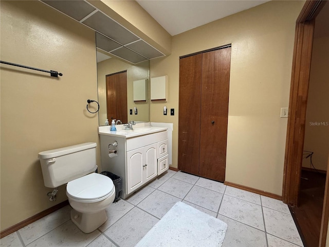 3957 Bearded Oaks Ct, Sarasota, FL 34232 - bathroom featuring baseboards, toilet, tile patterned floors, and vanity