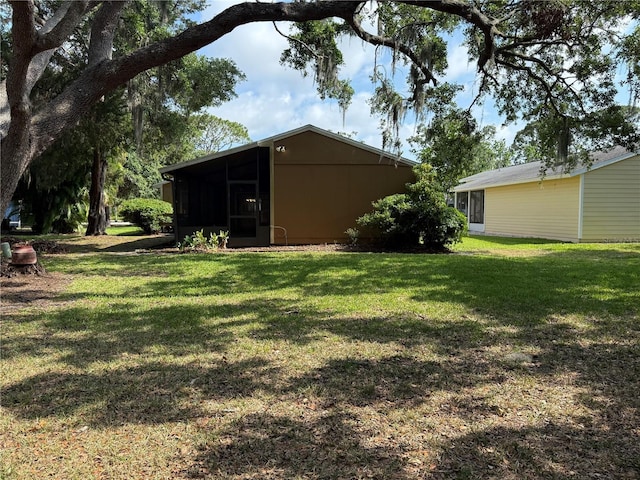 3957 Bearded Oaks Ct, Sarasota, FL 34232 - view of green lawn featuring a sunroom