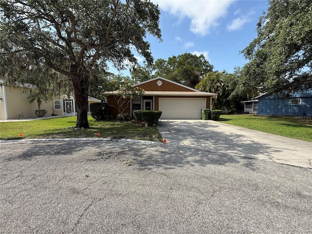 3957 Bearded Oaks Ct, Sarasota, FL 34232 - ranch-style house featuring driveway, a garage, and a front yard