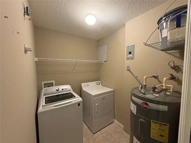 laundry room with washer and dryer, light tile patterned floors, laundry area, a textured ceiling, and electric water heater