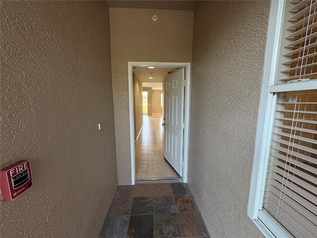 property entrance featuring stucco siding