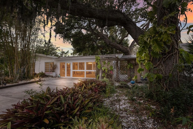 2207 Hickory Ave, Sarasota, FL 34234 - rear view of property with concrete driveway