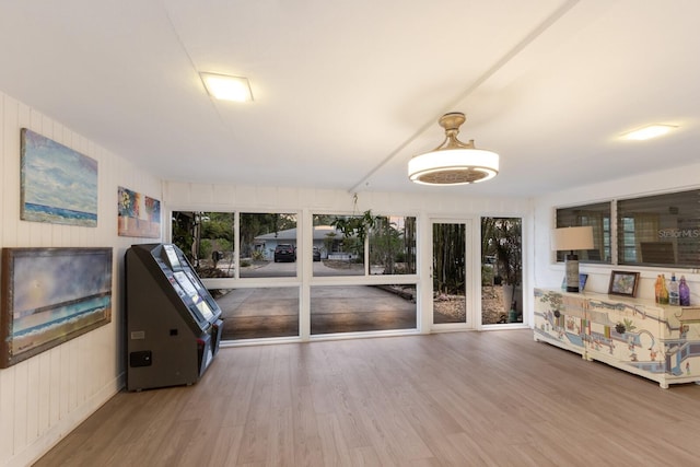 2207 Hickory Ave, Sarasota, FL 34234 - unfurnished living room featuring wood finished floors