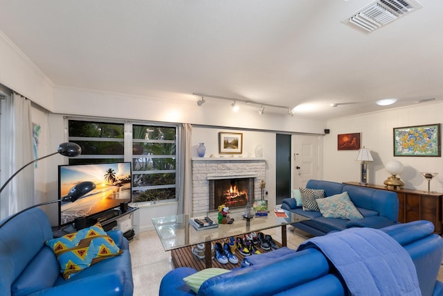 2207 Hickory Ave, Sarasota, FL 34234 - living area featuring a stone fireplace and track lighting