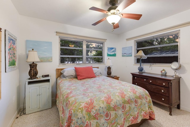 2207 Hickory Ave, Sarasota, FL 34234 - bedroom with multiple windows, baseboards, and ceiling fan
