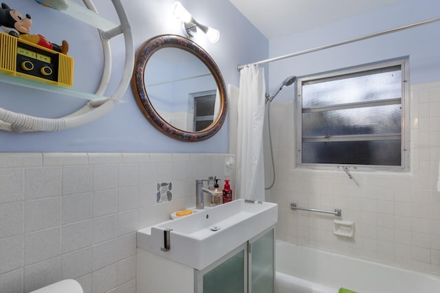 2207 Hickory Ave, Sarasota, FL 34234 - bathroom featuring tile walls, shower / bath combo, vanity, and toilet