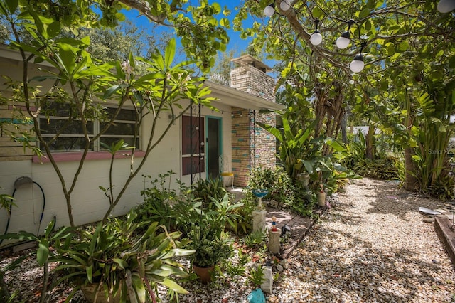 2207 Hickory Ave, Sarasota, FL 34234 - view of side of property with a chimney
