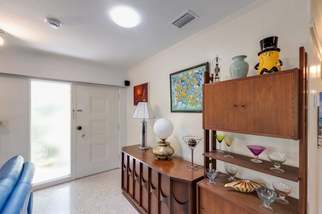 2207 Hickory Ave, Sarasota, FL 34234 - entryway with dark aggregate flooring and ornamental molding