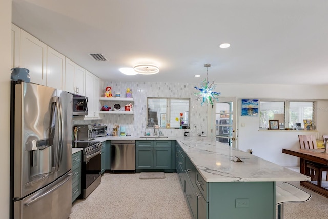 2207 Hickory Ave, Sarasota, FL 34234 - kitchen with appliances with stainless steel finishes, a peninsula, white cabinetry, open shelves, and a sink