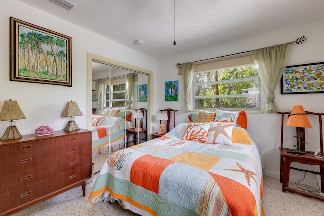 2207 Hickory Ave, Sarasota, FL 34234 - bedroom featuring speckle patterned floor, baseboards, and a closet