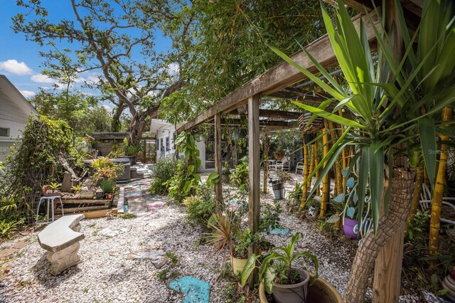 2207 Hickory Ave, Sarasota, FL 34234 - view of yard with a patio and a garden pond