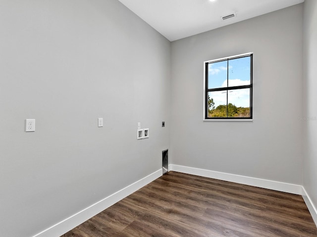 laundry room featuring laundry area, hookup for an electric dryer, visible vents, dark wood-style floors, and baseboards