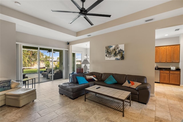 living room featuring a ceiling fan and recessed lighting