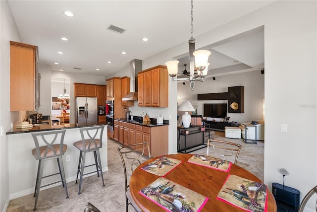 dining space featuring a chandelier and recessed lighting