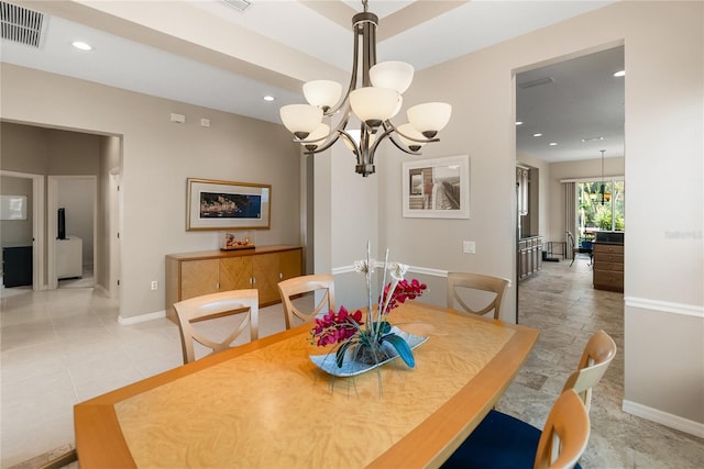 dining space featuring a chandelier, baseboards, and recessed lighting
