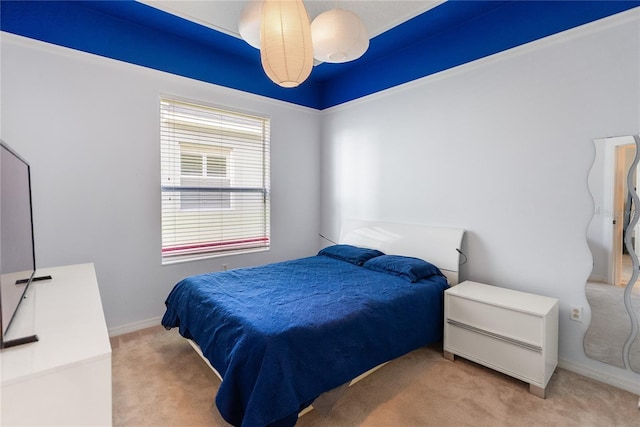 carpeted bedroom featuring baseboards