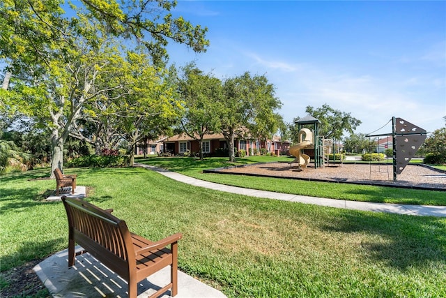 view of home's community with a yard