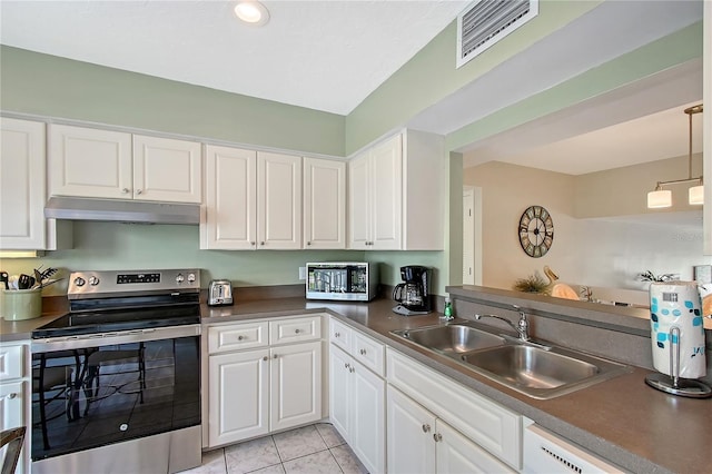 1159 Lake House Cir Unit C120, Sarasota, FL 34242 - kitchen featuring stainless steel appliances, under cabinet range hood, a sink, white cabinets, and light tile patterned floors