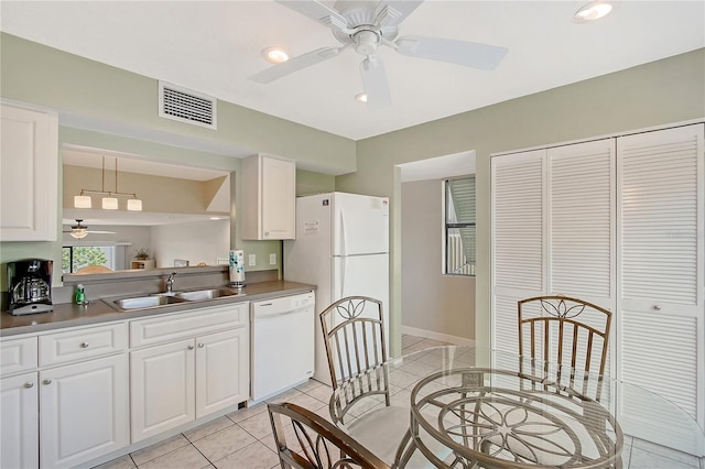 1159 Lake House Cir Unit C120, Sarasota, FL 34242 - kitchen with a sink, white appliances, a ceiling fan, white cabinetry, and light tile patterned floors