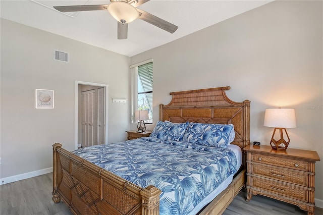 1159 Lake House Cir Unit C120, Sarasota, FL 34242 - bedroom featuring wood finished floors, ceiling fan, baseboards, and a closet