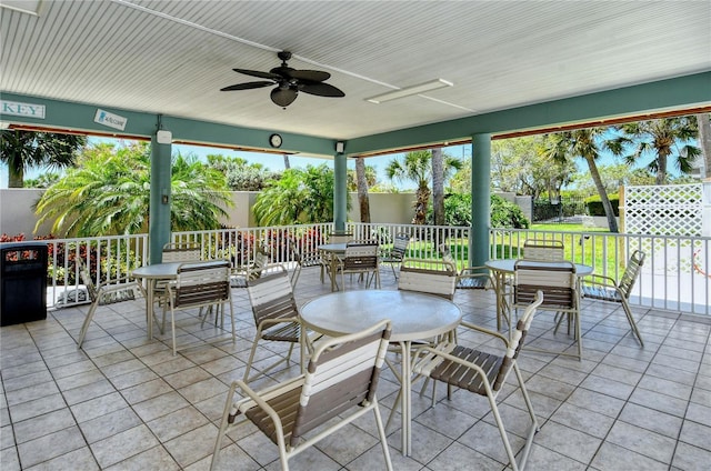 1159 Lake House Cir Unit C120, Sarasota, FL 34242 - view of patio / terrace with outdoor dining area, a fenced backyard, and a ceiling fan