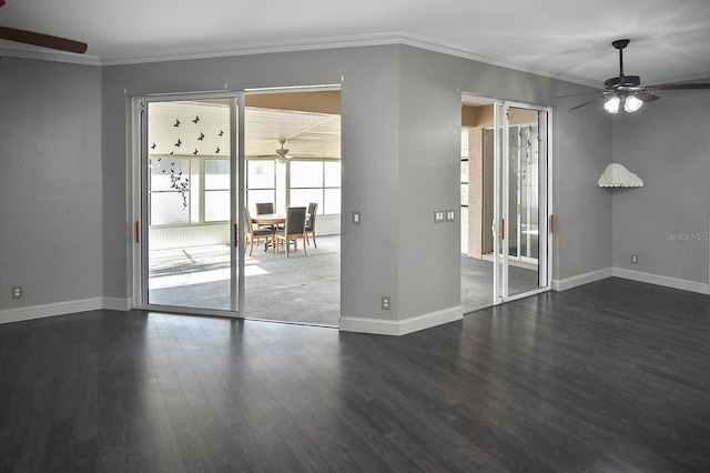 interior space featuring crown molding, baseboards, ceiling fan, and dark wood-style floors