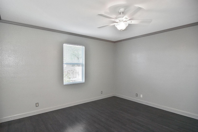 empty room with baseboards, ornamental molding, ceiling fan, and dark wood-style floors