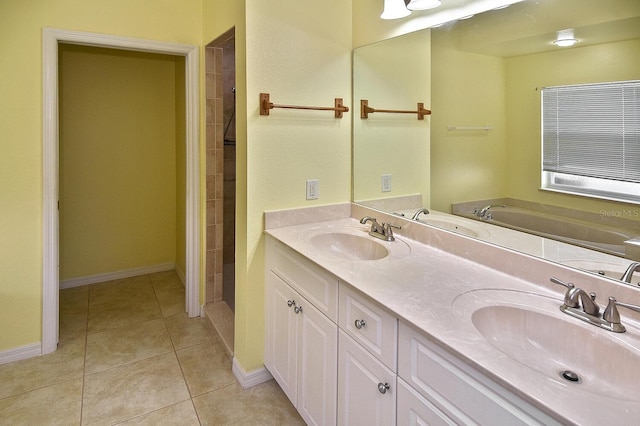 bathroom with double vanity, tile patterned flooring, and a sink