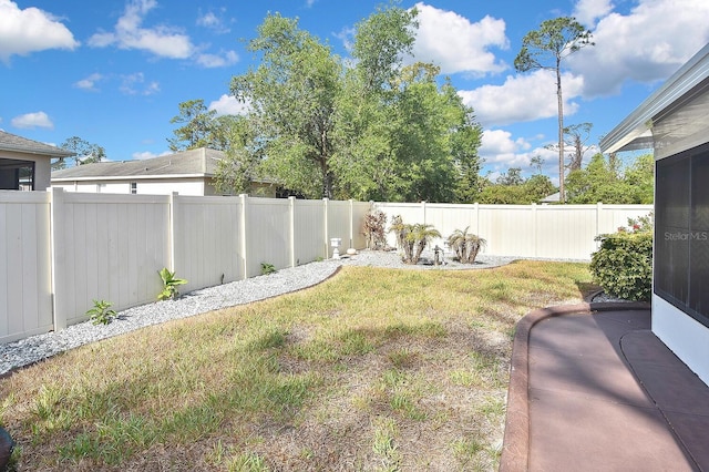 view of yard with a fenced backyard