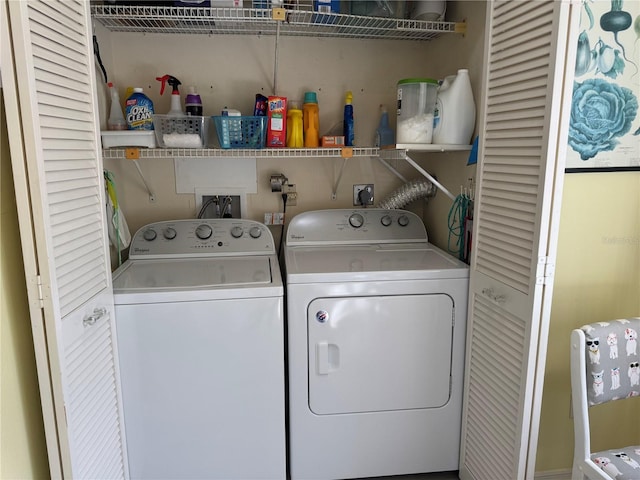 clothes washing area featuring washing machine and clothes dryer