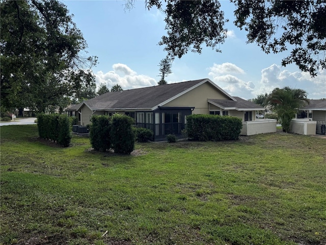 view of side of property featuring a yard